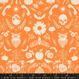an orange and white pattern with skulls and flowers