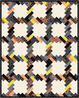 a quilt made with squares and dots