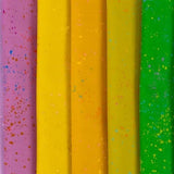 a close up of a row of different colored papers