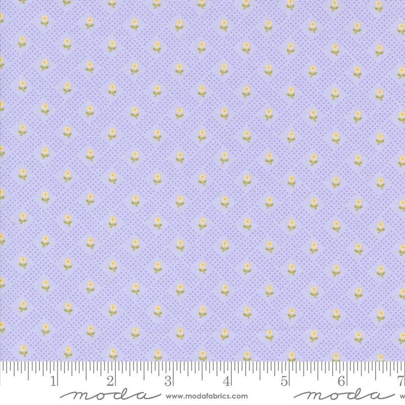 a ruler with a purple background and gold dots