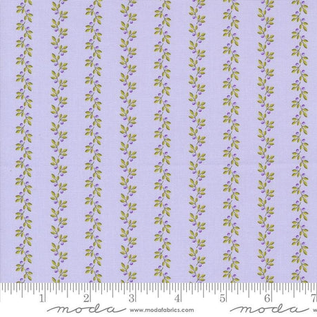 a purple and green striped fabric with leaves on it