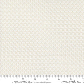 a ruler with a piece of paper on top of it