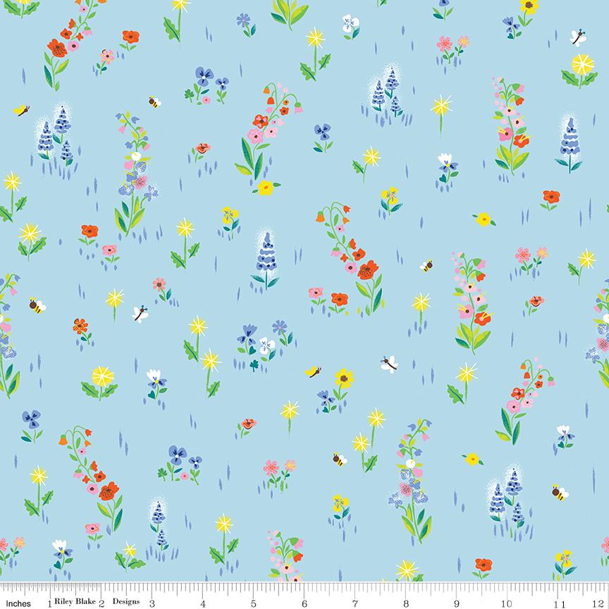 a blue background with a bunch of flowers on it