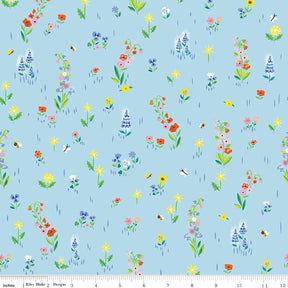a blue background with a bunch of flowers on it