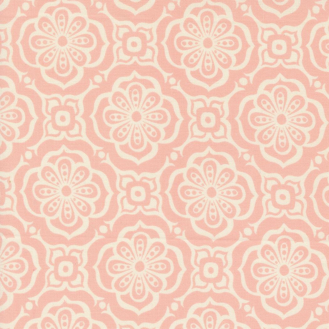 a pink and white flower pattern on fabric