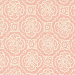 a pink and white flower pattern on fabric
