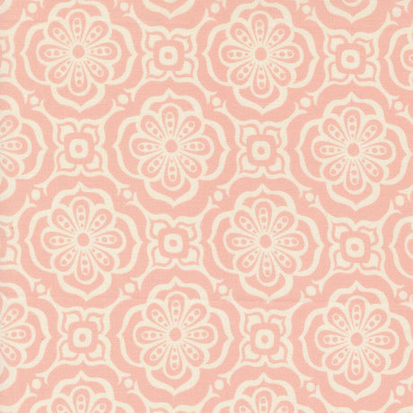 a pink and white flower pattern on fabric