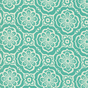 a green and white flower pattern on fabric