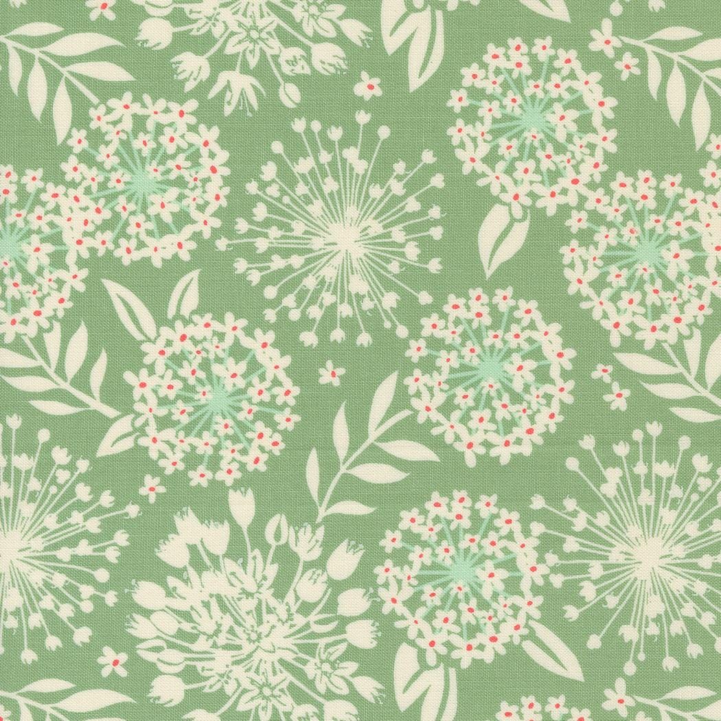 a green background with white and red flowers