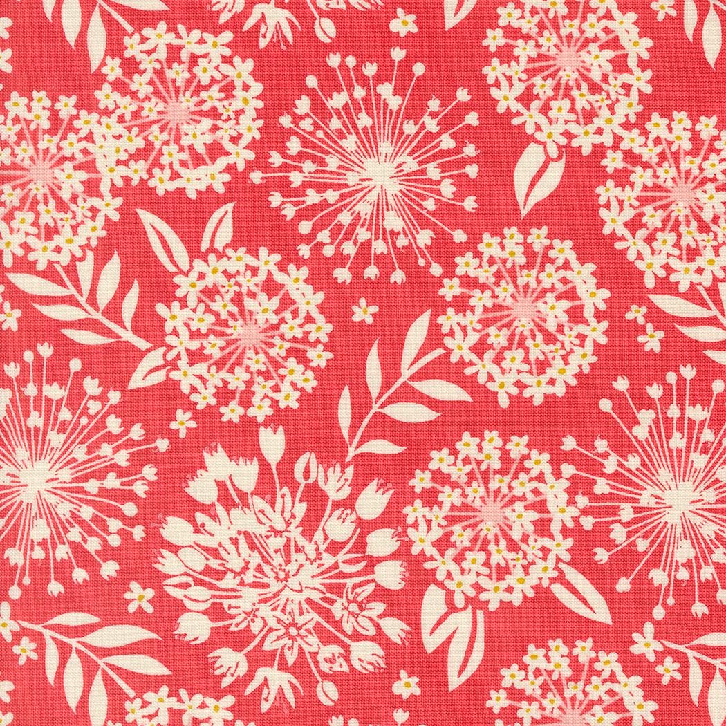 a red background with white flowers and leaves