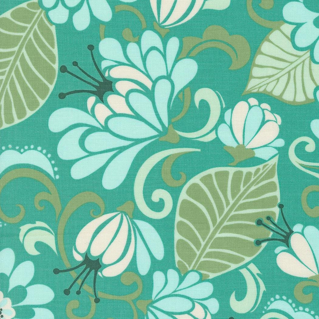 a blue and green floral pattern with leaves