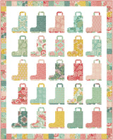 a quilted quilt with a bunch of boots on it