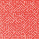 a red and white rug with a pattern on it