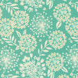 a blue and white flower pattern on a green background