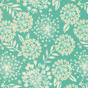 a blue and white flower pattern on a green background