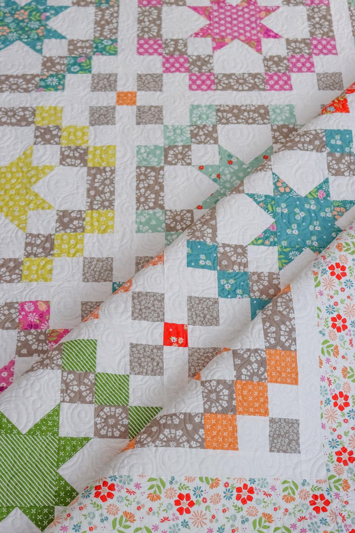 a close up of a quilt on a table