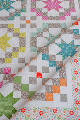 a close up of a quilt on a table