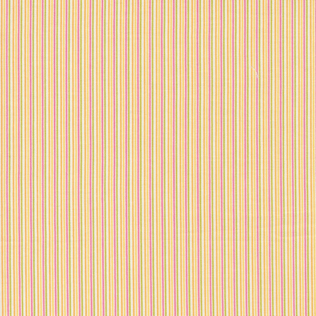 a close up of a yellow and red striped fabric