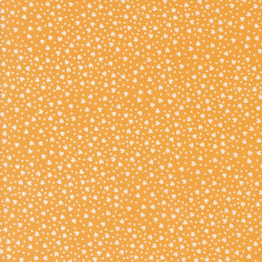 a yellow background with white spots on it