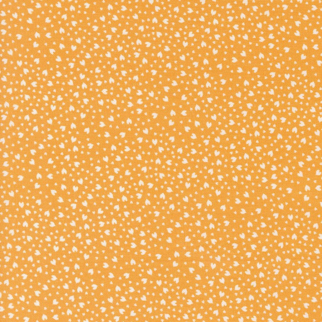 a yellow background with white spots on it