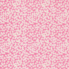 a pink and white background with small white flowers