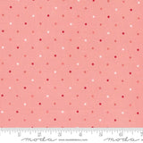 a pink and white polka dot print fabric