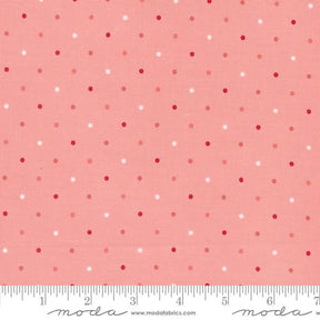 a pink and white polka dot print fabric