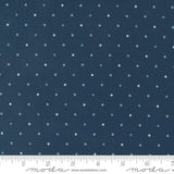 a ruler with a blue background with white polka dots