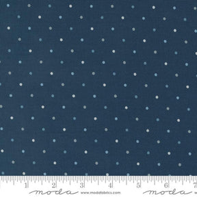 a ruler with a blue background with white polka dots
