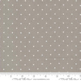 a gray and white polka dot print fabric