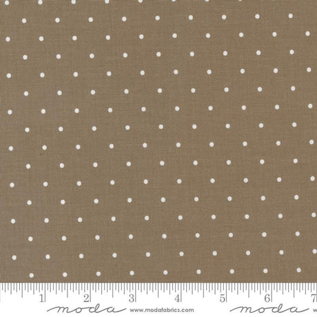 a brown and white polka dot fabric