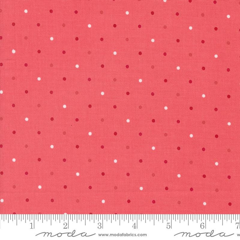 a red background with white polka dots