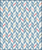 a blue and white quilt with a pattern on it