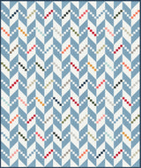 a blue and white quilt with a pattern on it