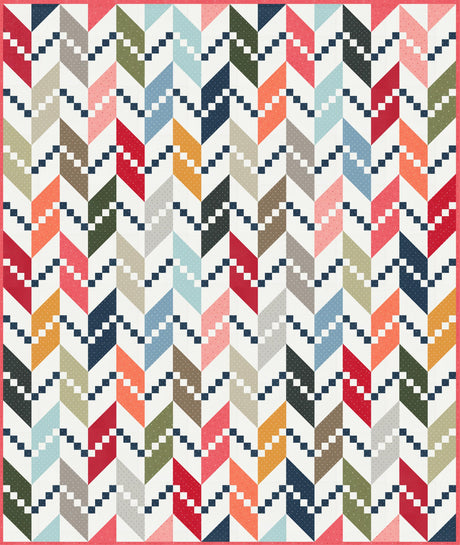 a multicolored quilt with a red border