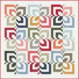 a multicolored quilt on a white background