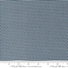 a ruler with a blue and white pattern on it