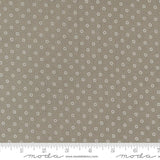 a ruler with a brown background with white circles