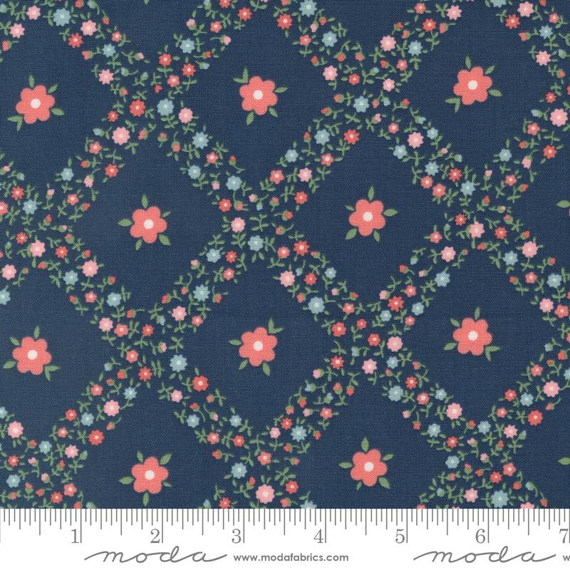 a blue background with pink flowers and green leaves