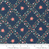 a blue background with pink flowers and green leaves