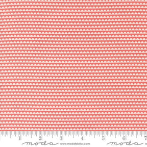 a pink and white background with a ruler