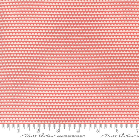 a pink and white background with a ruler