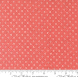 a ruler with a red background with white dots