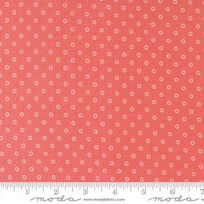 a ruler with a red background with white dots