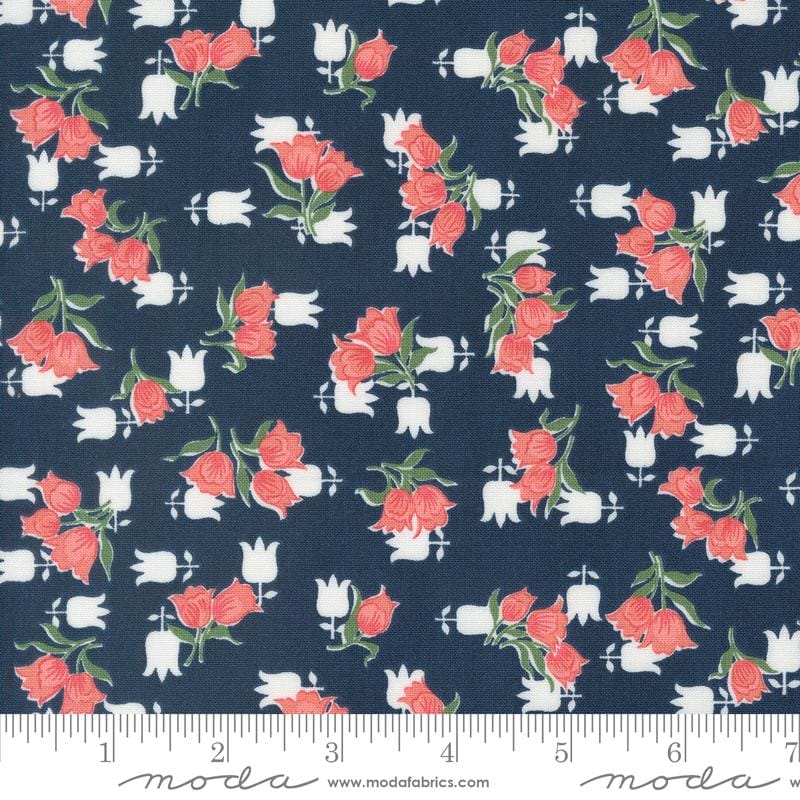 a blue fabric with red roses on it