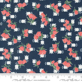 a blue fabric with red roses on it