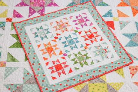 a close up of a quilt on a table