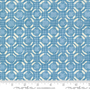 a blue and white fabric with circles on it