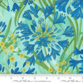 a blue and yellow flower on a green background