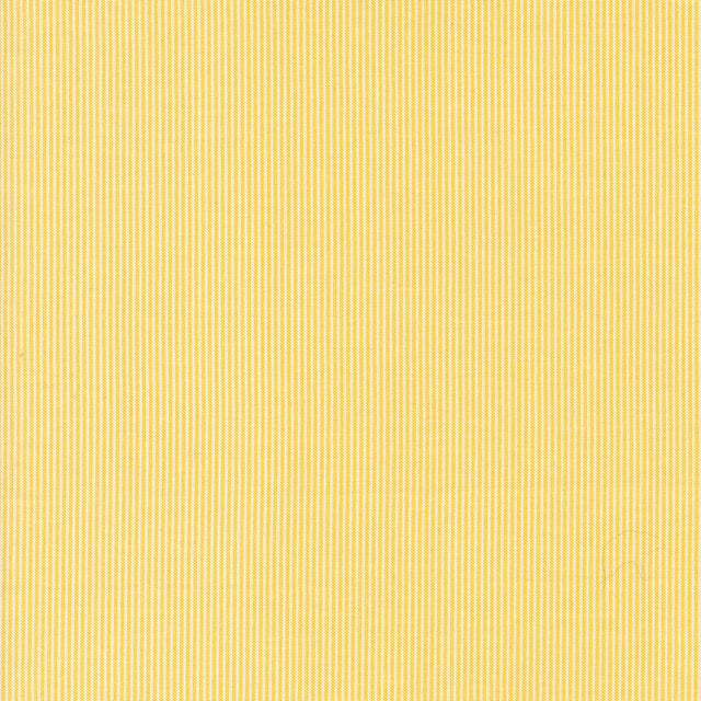 a close up of a yellow fabric texture